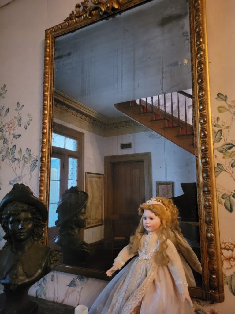 Mirror with dolls in front