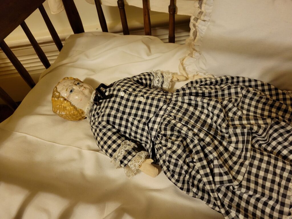 Doll in crib